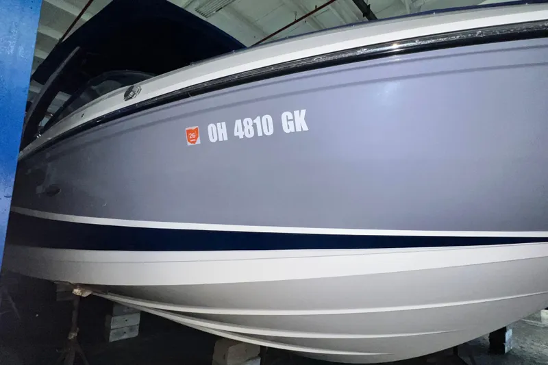 Slide: The Image of 2017 Sea Ray 280 SLX boat in storage, displaying registration number OH 4810 GK. - 3