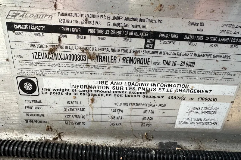 Slide: The Image of Tire and loading information label on a 2017 Sea Ray 280 SLX trailer. - 36