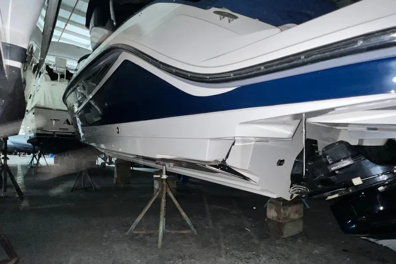 Slide: The Image of 2017 Sea Ray 280 SLX boat in storage, showcasing sleek design and powerful engine. - 8