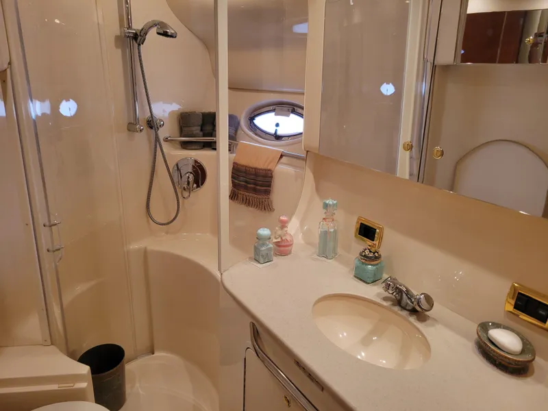 Slide: The Image of Luxurious bathroom in 2001 Sea Ray 450 Express Bridge yacht with shower and vanity. - 18