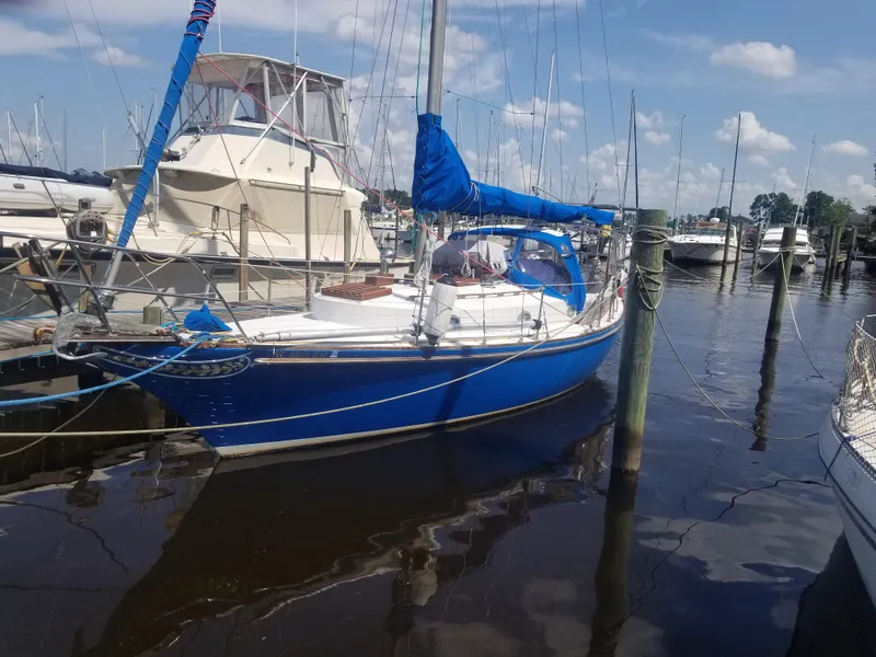The Image of Blue 1977 Ericson 31 sailboat docked in marina. - 0