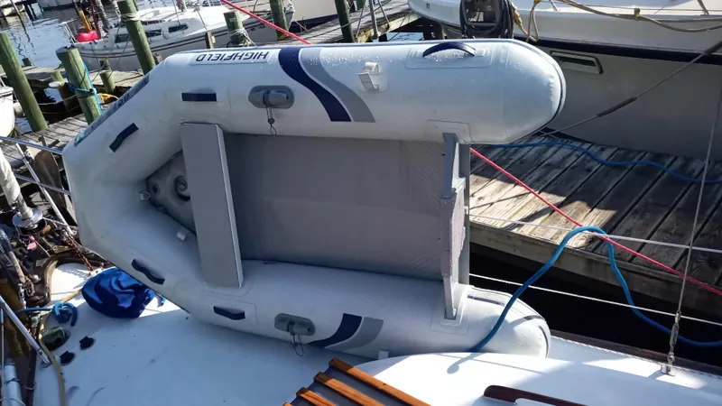 Slide: The Image of Inflatable dinghy on a 1977 Ericson 31 sailboat. - 16