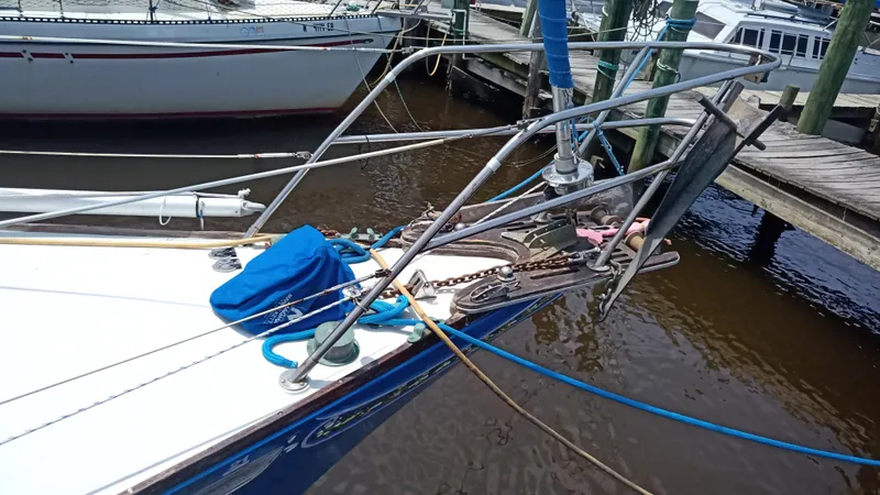Slide: The Image of Bow of a 1977 Ericson 31 sailboat docked in harbor. - 18