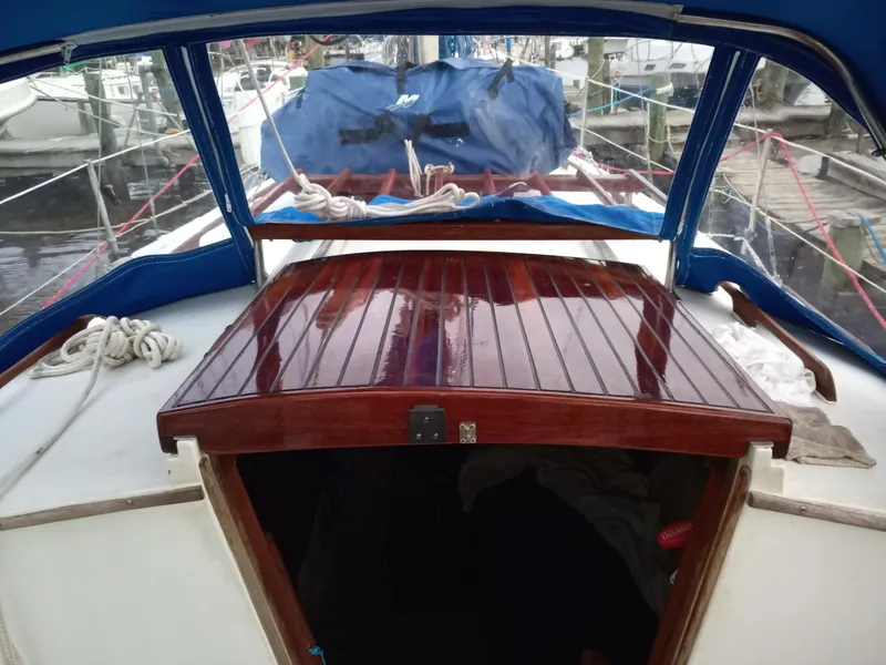 Slide: The Image of Interior view of a 1977 Ericson 31 sailboat with wooden trim. - 6