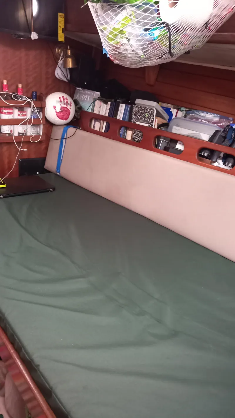 Slide: The Image of Interior of a 1977 Ericson 31 sailboat with sleeping area. - 8