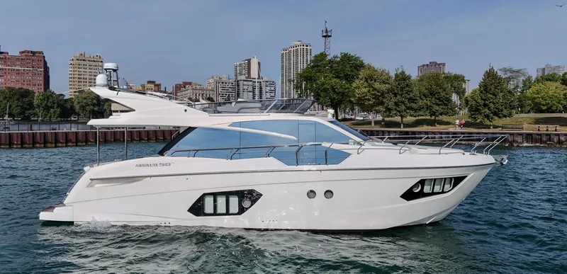 Slide: The Image of 2017 Absolute 50 Fly yacht cruising near city waterfront with skyline in background. - 0