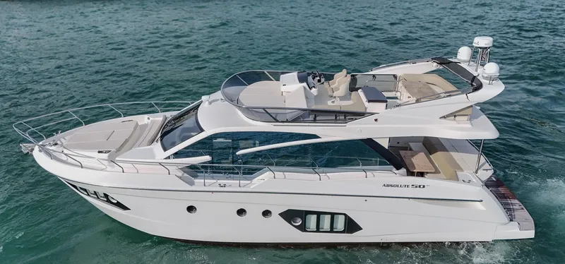 Slide: The Image of Luxurious 2017 Absolute 50 Fly yacht cruising on clear blue waters. - 1