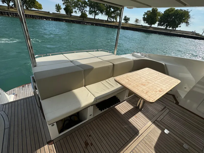 Slide: The Image of Luxury seating area on 2017 Absolute 50 Fly yacht with scenic water view. - 12