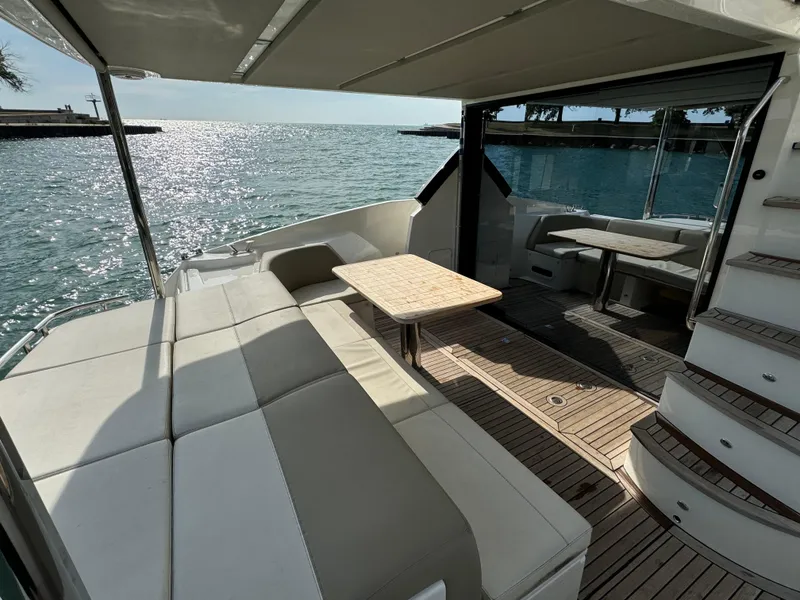 Slide: The Image of Luxurious 2017 Absolute 50 Fly yacht with spacious deck and elegant seating area. - 13