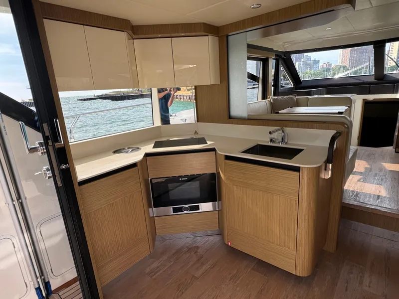 Slide: The Image of Luxurious interior of 2017 Absolute 50 Fly yacht with modern kitchen and scenic water view. - 14
