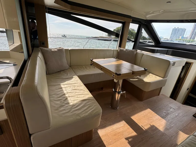 Slide: The Image of Luxurious interior of 2017 Absolute 50 Fly yacht with elegant seating and table. - 19