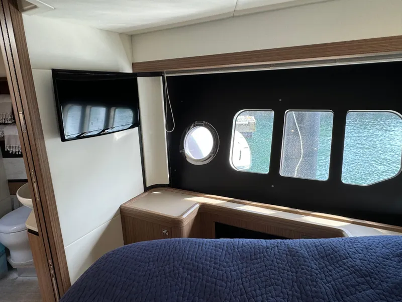 Slide: The Image of Interior of 2017 Absolute 50 Fly yacht with window view and modern amenities. - 24