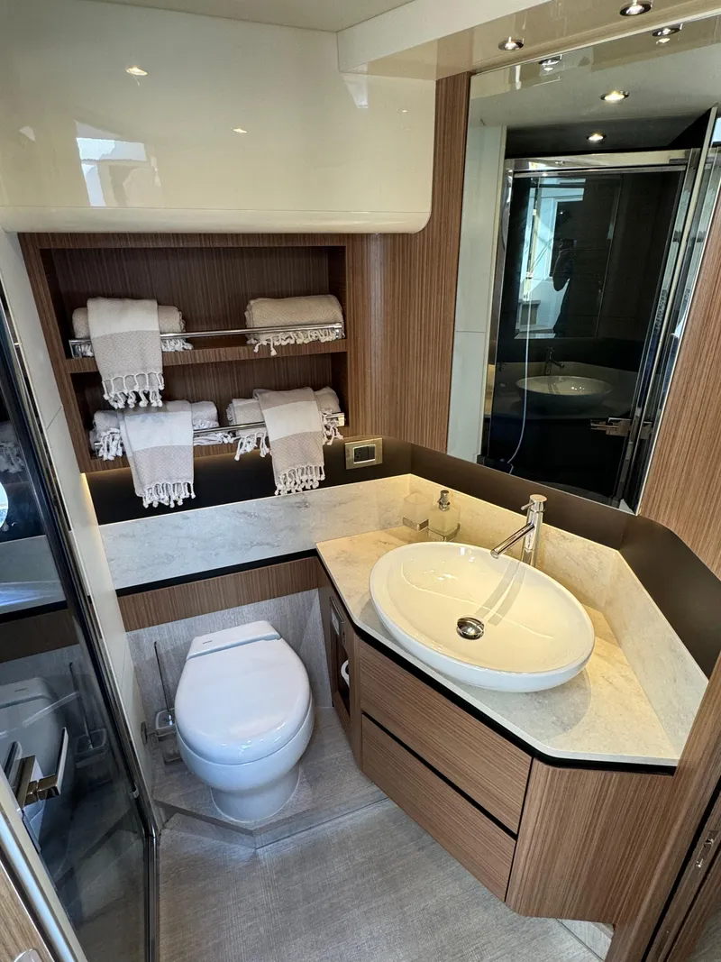Slide: The Image of Luxurious bathroom in 2017 Absolute 50 Fly yacht with modern fixtures and elegant design. - 25
