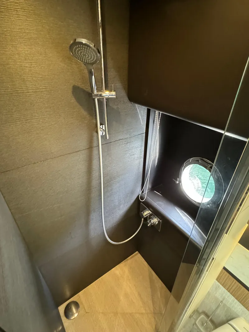 Slide: The Image of Shower area in 2017 Absolute 50 Fly yacht with porthole and modern fixtures. - 26