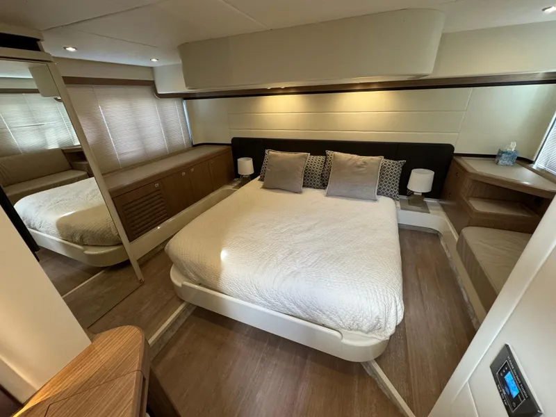 Slide: The Image of Luxurious bedroom interior of 2017 Absolute 50 Fly yacht with modern decor and cozy bedding. - 27