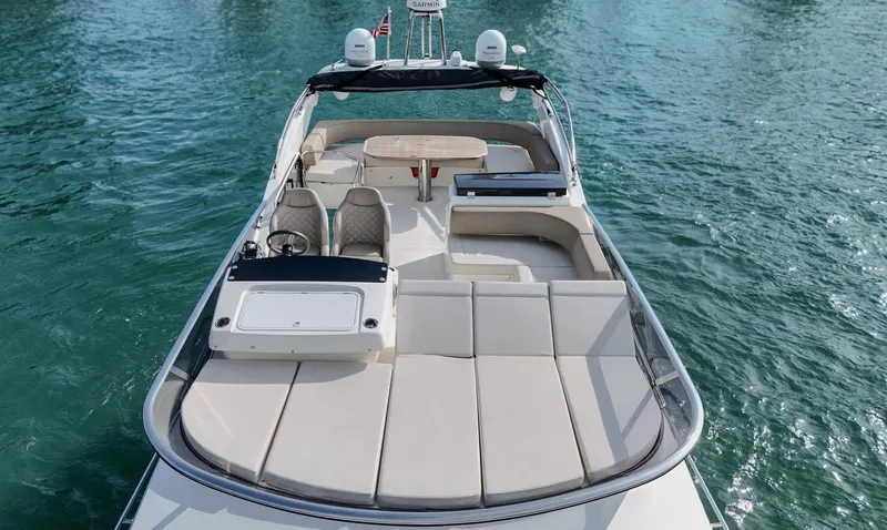 Slide: The Image of Luxury Absolute 50 Fly yacht, 2017 model, with spacious deck and seating on calm waters. - 4