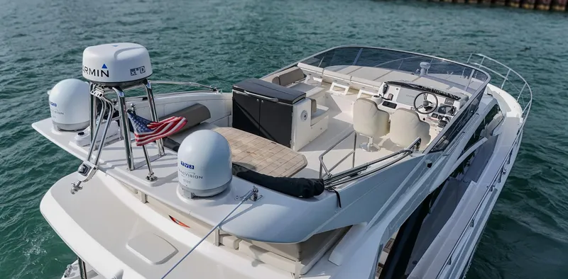 Slide: The Image of 2017 Absolute 50 Fly yacht with spacious deck and modern navigation equipment on the water. - 5