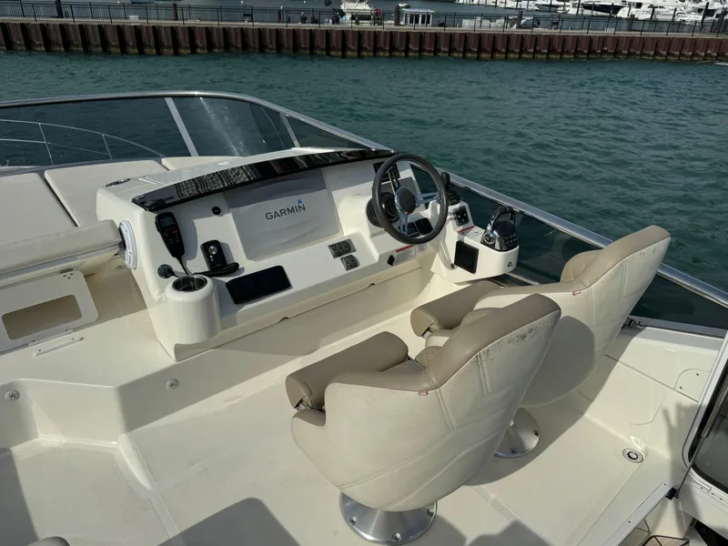 Slide: The Image of Flybridge helm of 2017 Absolute 50 Fly yacht with Garmin navigation system. - 9