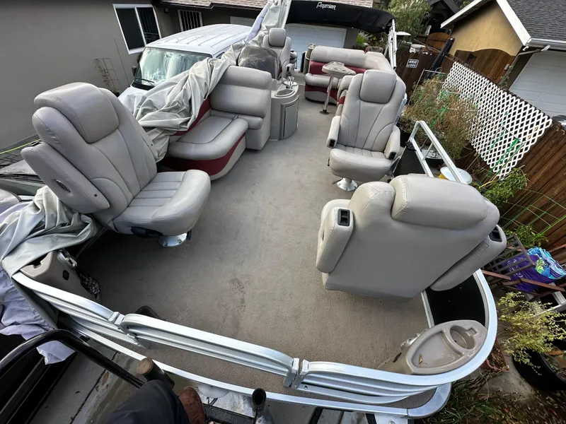 Slide: The Image of 2009 Premier 251 Castaway pontoon boat with spacious seating and covered interior. - 13
