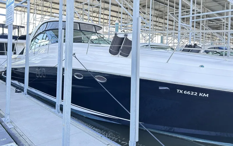 Slide: The Image of 2007 Sea Ray 52 Sundancer yacht docked in marina, side view. - 10