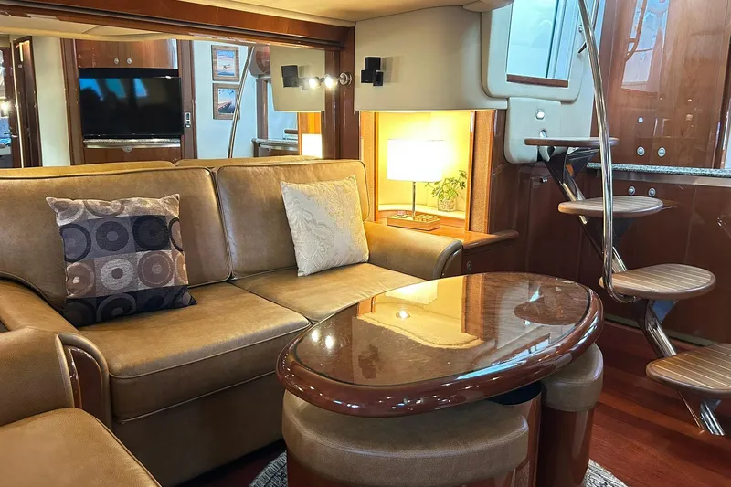 Slide: The Image of Luxurious interior of a 2007 Sea Ray 52 Sundancer yacht with elegant seating and wooden accents. - 16