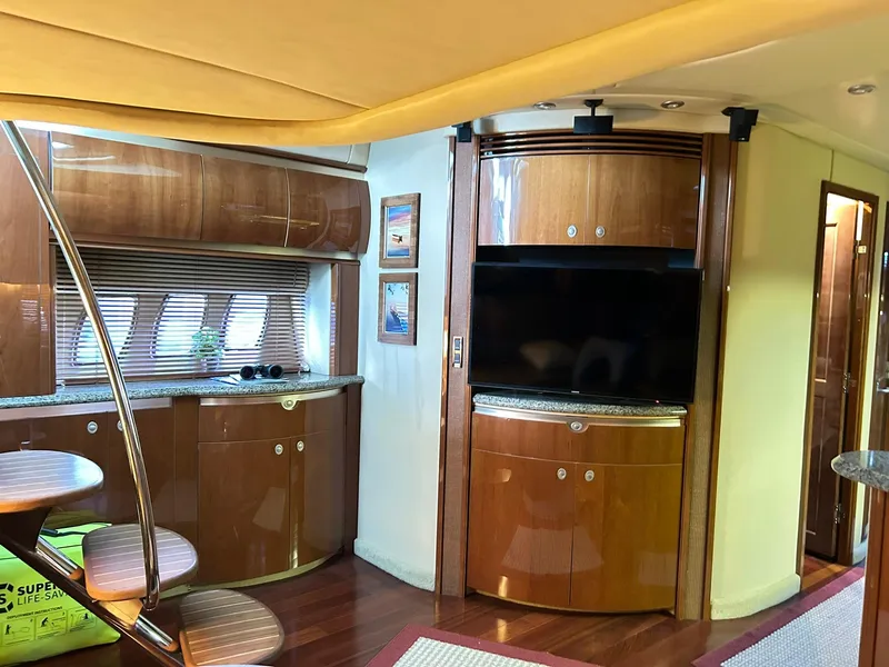 Slide: The Image of Luxurious interior of a 2007 Sea Ray 52 Sundancer yacht with wood cabinetry and modern amenities. - 18