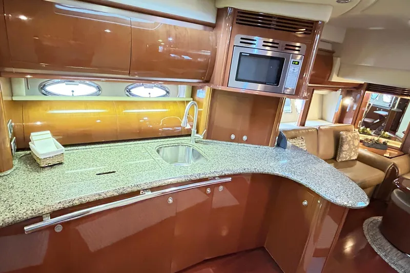 Slide: The Image of Luxurious 2007 Sea Ray 52 Sundancer yacht interior with modern kitchen and elegant design. - 25