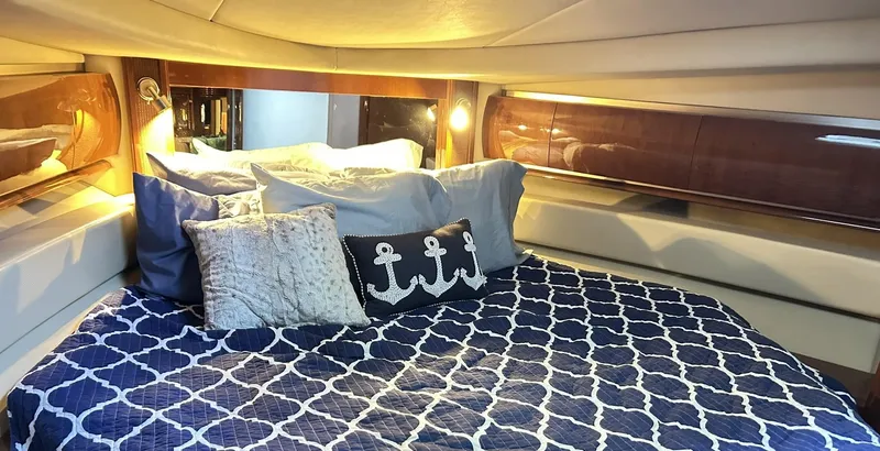 Slide: The Image of Luxurious cabin interior of 2007 Sea Ray 52 Sundancer with nautical-themed bedding. - 31