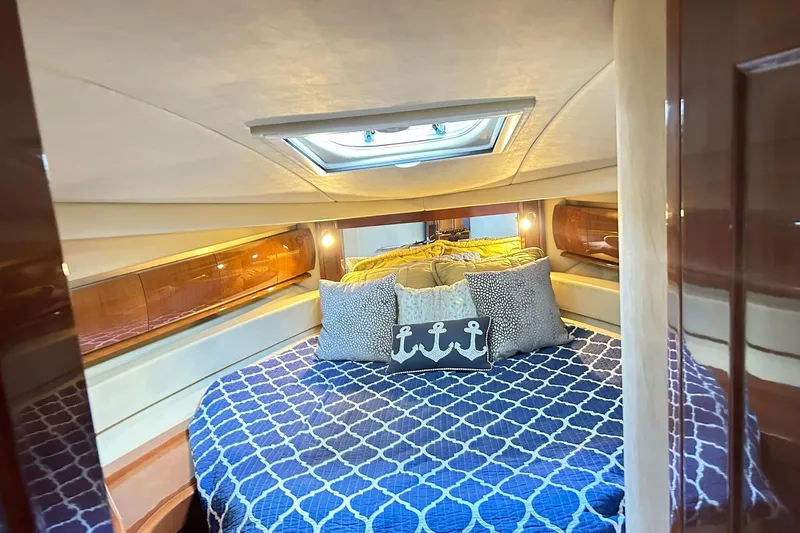 Slide: The Image of Luxurious cabin interior of 2007 Sea Ray 52 Sundancer yacht with elegant bedding. - 32