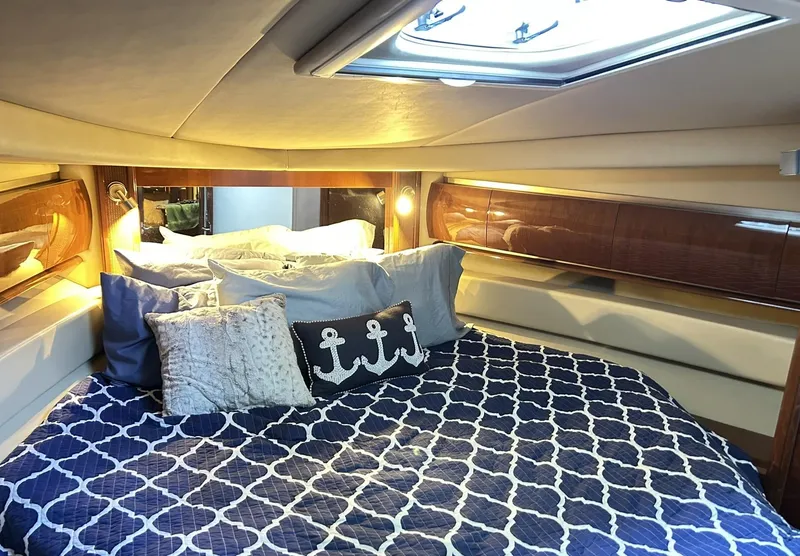 Slide: The Image of Luxurious cabin interior of 2007 Sea Ray 52 Sundancer yacht with nautical-themed bedding. - 33