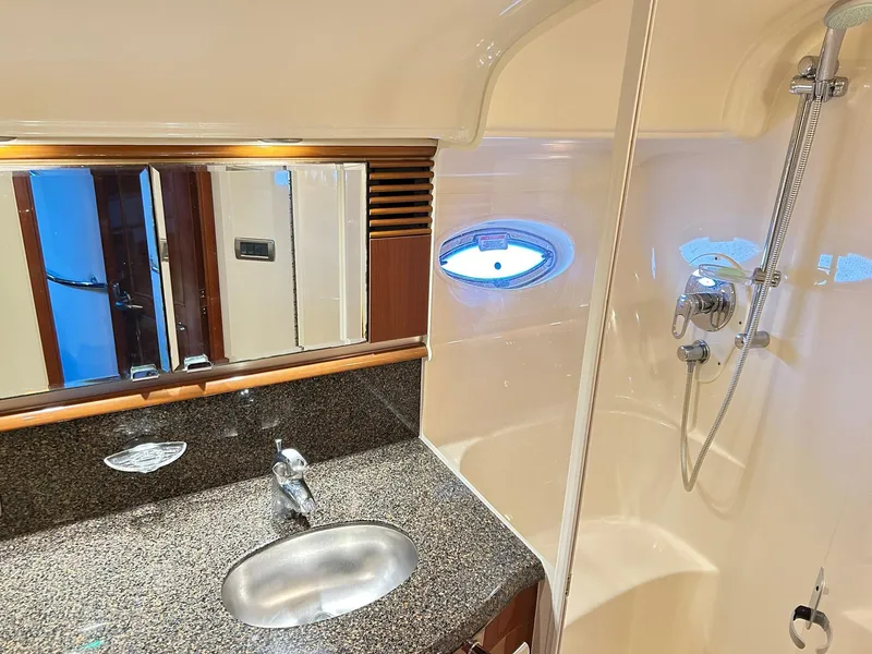 Slide: The Image of Luxurious bathroom interior of 2007 Sea Ray 52 Sundancer yacht with granite countertop and shower. - 36