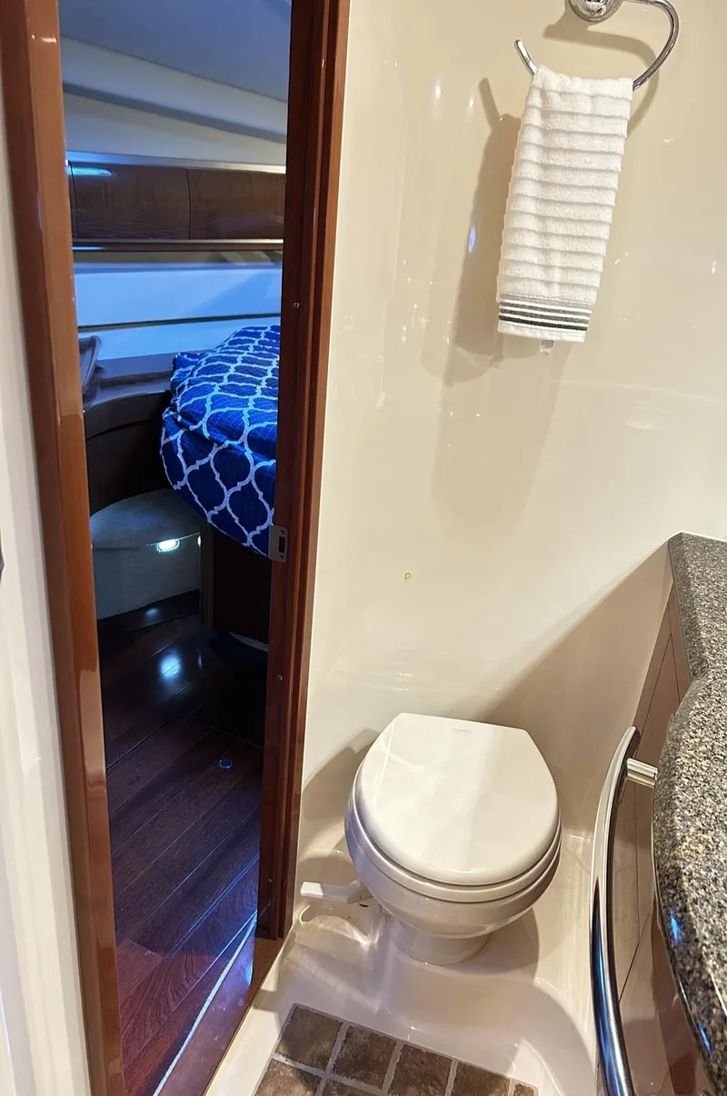 Slide: The Image of 2007 Sea Ray 52 Sundancer interior with bathroom and bedroom view. - 38