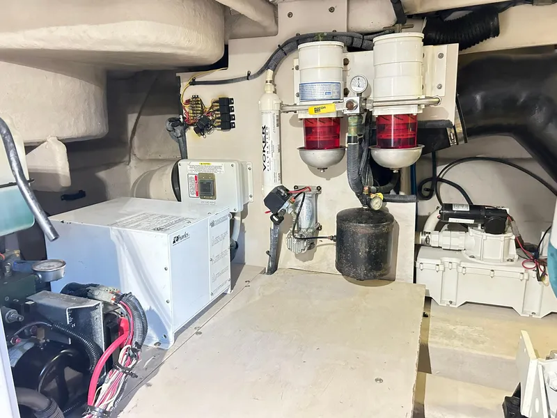 Slide: The Image of Engine room of 2007 Sea Ray 52 Sundancer with mechanical components and wiring. - 43