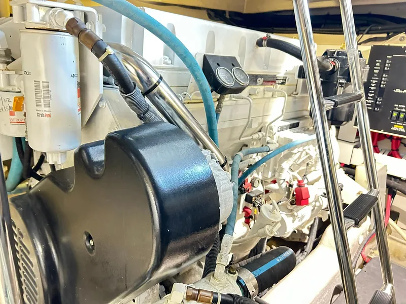 Slide: The Image of Engine room of a 2007 Sea Ray 52 Sundancer yacht, showcasing mechanical components. - 45
