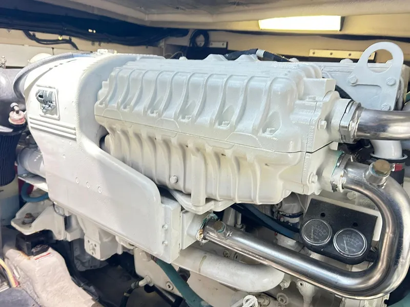 Slide: The Image of Engine of a 2007 Sea Ray 52 Sundancer boat, showcasing detailed mechanical components. - 46