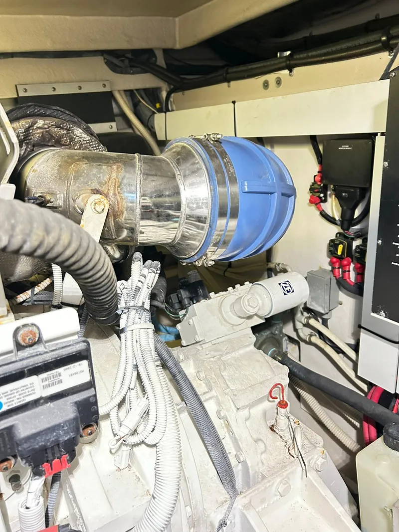 Slide: The Image of Engine room of 2007 Sea Ray 52 Sundancer yacht, showcasing mechanical components and wiring. - 47