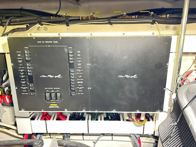 Slide: The Image of Electrical panel of a 2007 Sea Ray 52 Sundancer yacht, showcasing wiring and controls. - 48
