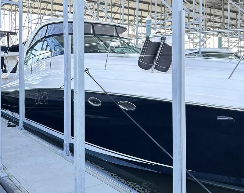 Slide: The Image of 2007 Sea Ray 52 Sundancer yacht docked in a marina, showcasing sleek design and luxury features. - 5