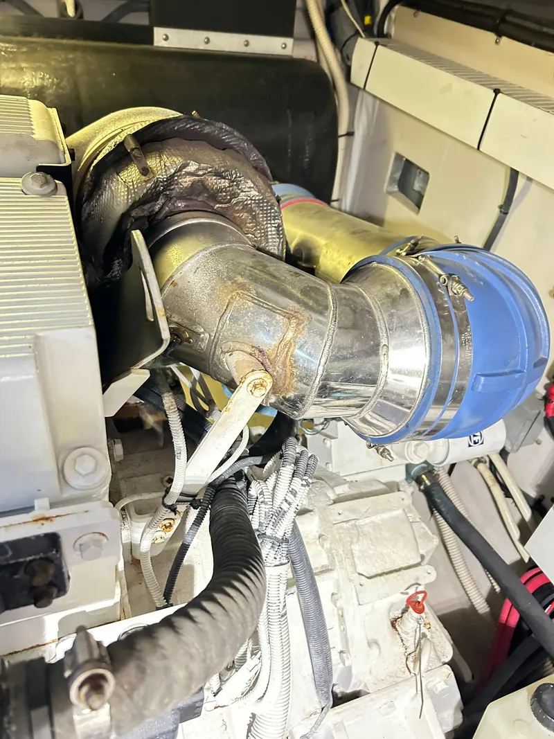 Slide: The Image of Engine compartment of a 2007 Sea Ray 52 Sundancer yacht, showcasing mechanical components. - 50