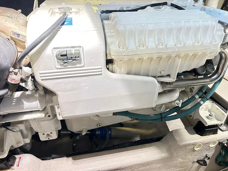 Slide: The Image of Engine compartment of a 2007 Sea Ray 52 Sundancer boat, showcasing detailed machinery. - 51