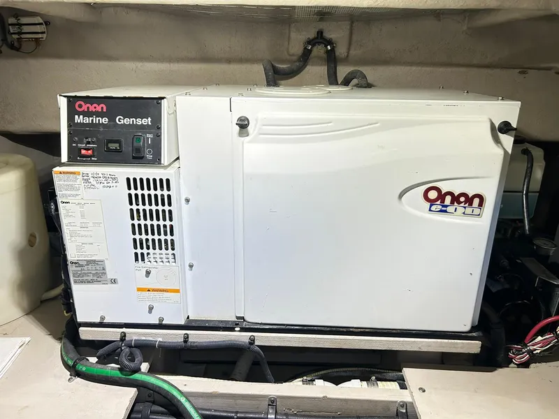 Slide: The Image of Onan marine generator in a 2007 Sea Ray 52 Sundancer yacht engine room. - 52
