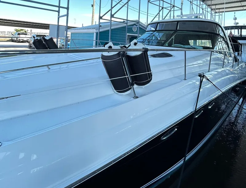 Slide: The Image of 2007 Sea Ray 52 Sundancer yacht docked in marina, showcasing sleek design and modern features. - 6