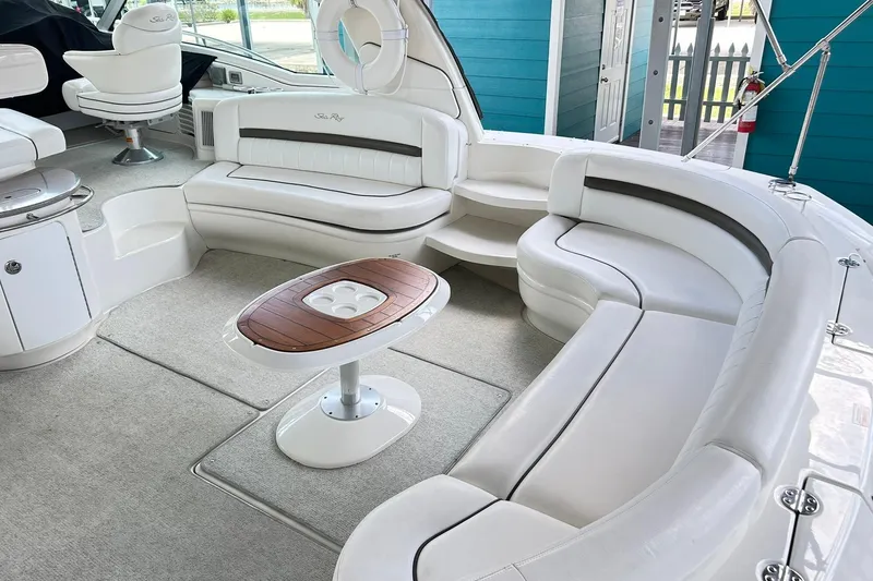 Slide: The Image of Luxurious 2007 Sea Ray 52 Sundancer yacht interior with plush white seating and elegant table. - 76