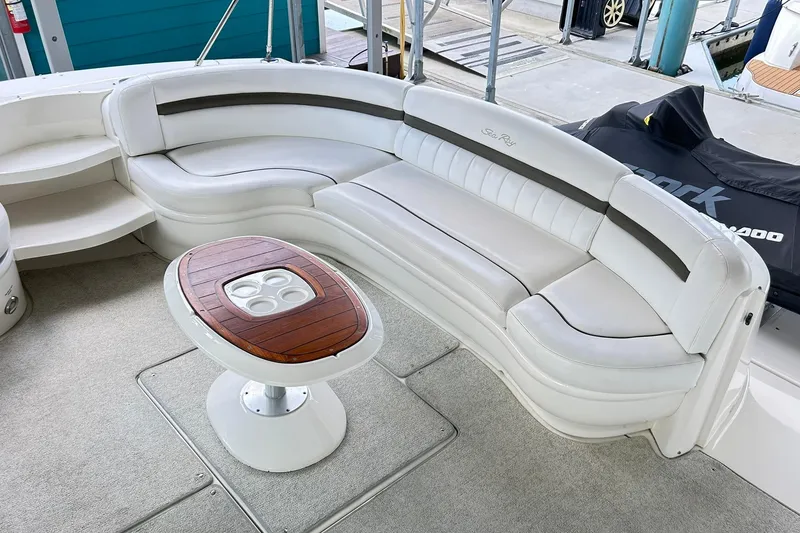 Slide: The Image of Luxurious 2007 Sea Ray 52 Sundancer yacht with elegant white seating and wooden table. - 77