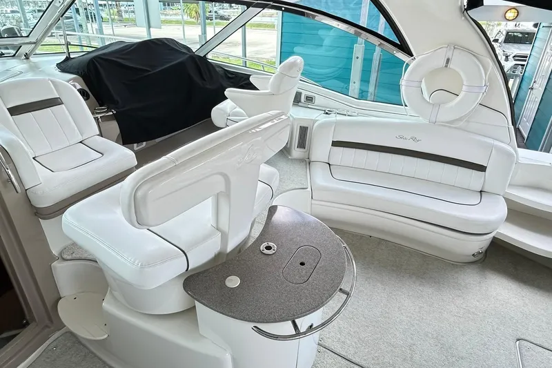 Slide: The Image of Luxurious 2007 Sea Ray 52 Sundancer yacht interior with white leather seating and modern design. - 78