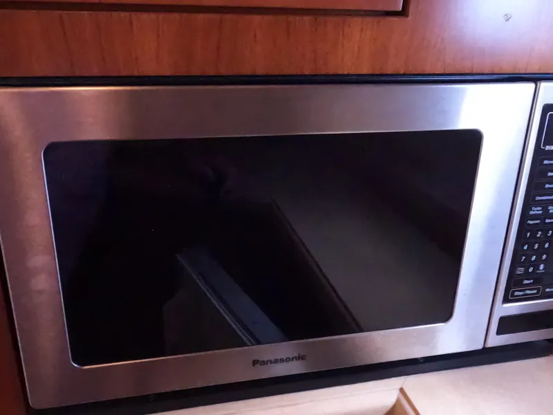 Slide: The Image of Panasonic microwave in 2004 Tiara Yachts 4400 Sovran kitchen area. - 19