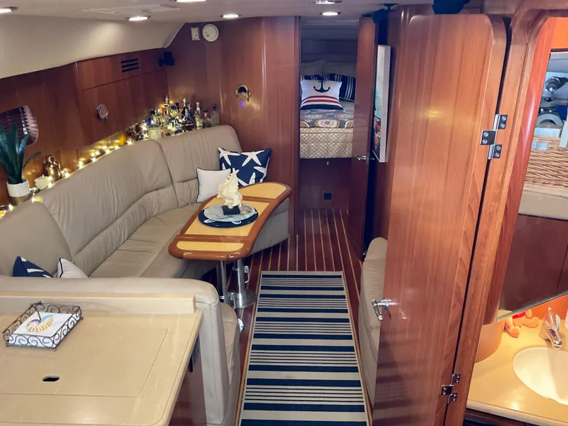 Slide: The Image of Luxurious 2004 Tiara Yachts 4400 Sovran interior with cozy seating and elegant decor. - 2