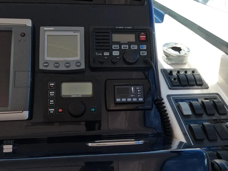 Slide: The Image of Dashboard of 2004 Tiara Yachts 4400 Sovran with navigation and communication equipment. - 25