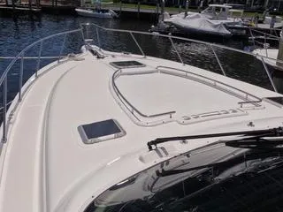 Slide: The Image of 2004 Tiara Yachts 4400 Sovran boat deck with railing, docked at marina. - 32