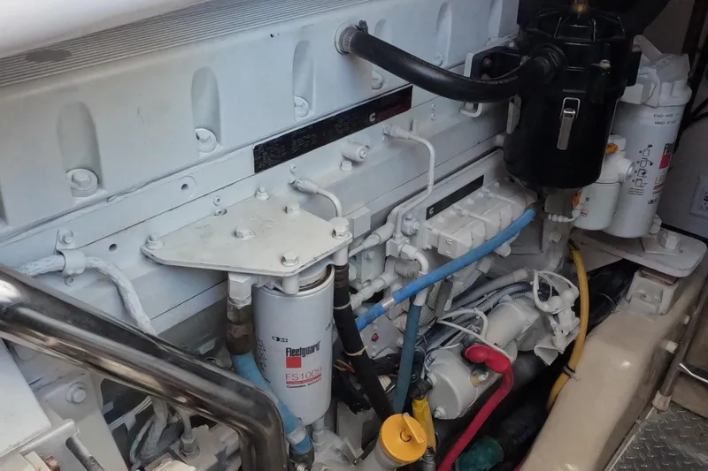 Slide: The Image of Engine compartment of 2004 Tiara Yachts 4400 Sovran, showcasing detailed mechanical components. - 41